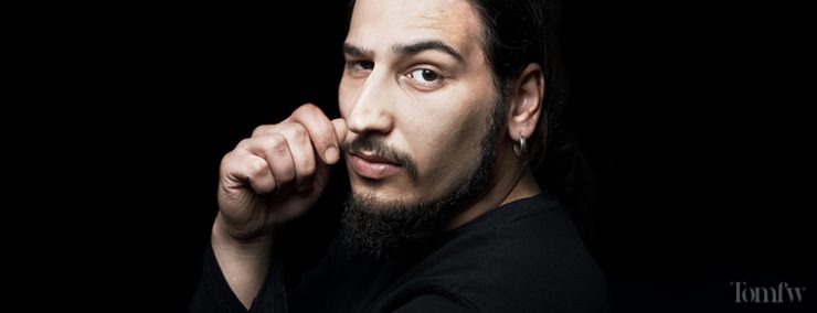 man holding his mustache