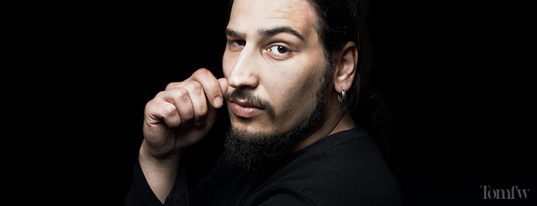 man holding his mustache